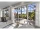 The screened lanai features a seating area and tropical views at 4260 Wordsworth Way, Venice, FL 34293