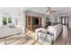 Open-concept living room featuring a large entertainment center and comfortable seating at 4260 Wordsworth Way, Venice, FL 34293