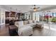 Inviting living space with a comfortable sofa, modern kitchen, and access to the outdoor patio at 4260 Wordsworth Way, Venice, FL 34293