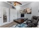 Home office featuring a wooden desk, leather chair, and natural light from the window at 4260 Wordsworth Way, Venice, FL 34293