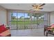Enjoy stunning golf course views from this bright, screened-in balcony with ceiling fan and comfortable seating at 437 Cerromar Ln # 414, Venice, FL 34293