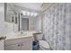 Bathroom with vanity sink, mirror and a shower and tub combo at 437 Cerromar Ln # 414, Venice, FL 34293