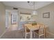 Dining room with seating for four and stylish pendant lighting at 437 Cerromar Ln # 414, Venice, FL 34293