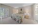 Bright main bedroom with access to the outdoors and an ensuite bathroom at 437 Cerromar Ln # 414, Venice, FL 34293