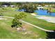 Aerial view of a lush golf course community with serene ponds and verdant landscaping at 437 Cerromar Ln # 513, Venice, FL 34293