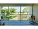 Relaxing balcony view overlooking the golf course and mature trees at 437 Cerromar Ln # 513, Venice, FL 34293
