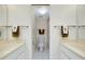 Bright bathroom with a toilet, shower, and double sink vanity at 437 Cerromar Ln # 513, Venice, FL 34293