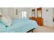 Comfortable bedroom featuring a dresser and a sliding glass door with balcony access at 437 Cerromar Ln # 513, Venice, FL 34293