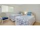 Cozy bedroom with natural light and two beds at 437 Cerromar Ln # 513, Venice, FL 34293