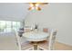 Comfortable dining area adjacent to the living room with seating for four at 437 Cerromar Ln # 513, Venice, FL 34293