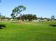 Picturesque view of a well-manicured golf course with mature trees and green fairways at 437 Cerromar Ln # 513, Venice, FL 34293