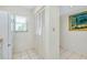 Hallway with closet and tile floor, offering convenient storage and access to other areas at 437 Cerromar Ln # 513, Venice, FL 34293