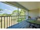Charming screened patio area with views of a lush green golf course, table, and chairs at 437 Cerromar Ln # 513, Venice, FL 34293