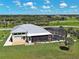An inviting home with a screened-in pool and a spacious driveway, nestled in a serene location at 48 Lark Dr, Placida, FL 33946