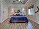 Well-lit bedroom with ceiling fan and aviation-themed decor at 48 Lark Dr, Placida, FL 33946