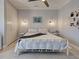 Cozy bedroom with stylish furniture, ceiling fan, and ample closet space at 48 Lark Dr, Placida, FL 33946