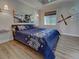 Comfortable bedroom showcasing a cozy bed and aviation-themed decor at 48 Lark Dr, Placida, FL 33946