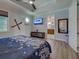 Stylish bedroom with modern décor, TV, and ensuite bathroom at 48 Lark Dr, Placida, FL 33946