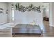 The gray cushioned bench in the entryway offers a comfortable spot to sit and relax at 48 Lark Dr, Placida, FL 33946