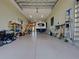 Spacious garage featuring ample storage, vehicle parking, and utility equipment at 48 Lark Dr, Placida, FL 33946