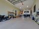 Spacious garage featuring ample storage, vehicle parking, and utility equipment at 48 Lark Dr, Placida, FL 33946