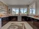 Bright kitchen with dark cabinets, granite countertops, stainless steel appliances, and ample storage at 48 Lark Dr, Placida, FL 33946