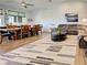 Open concept living area with wood floors, large windows, and dining area at 48 Lark Dr, Placida, FL 33946