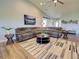 Open concept living area featuring comfortable sofa, area rug, and stylish decor at 48 Lark Dr, Placida, FL 33946
