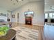 An open-concept living area with wood floors, fireplace, and stylish decor throughout at 48 Lark Dr, Placida, FL 33946