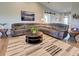 Open concept living area with comfortable sofa, area rug, and decor at 48 Lark Dr, Placida, FL 33946