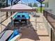 Inviting screened-in pool, patio area with outdoor furniture for relaxation and entertaining at 48 Lark Dr, Placida, FL 33946
