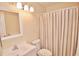 Clean bathroom with a neutral color scheme, a vanity, and a shower/tub combo at 528 Barcelona Ave # 216, Venice, FL 34285