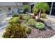 Well maintained landscaping with mulch, greenery and small flowering plants and fountain at 528 Barcelona Ave # 216, Venice, FL 34285