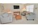 Inviting living room with comfortable seating and plenty of natural light at 528 Barcelona Ave # 216, Venice, FL 34285