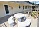This patio features a white picnic table with benches and a ramp to the building entrances at 528 Barcelona Ave # 216, Venice, FL 34285