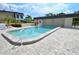 Sparkling community swimming pool with ample area for residents with nearby cabana at 528 Barcelona Ave # 216, Venice, FL 34285