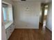 Bright dining room with built-in display cabinet and wainscoting, creating an inviting space for Gathering meals at 529 Cervina S Dr, Venice, FL 34285
