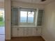 Charming dining area featuring built-in cabinets and a window, offering a cozy and functional space at 529 Cervina S Dr, Venice, FL 34285