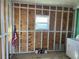 Laundry Room with exposed framing and plywood walls plus a window and American Flag at 529 Cervina S Dr, Venice, FL 34285