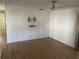 Living room with modern flooring and tv wall mount at 529 Cervina S Dr, Venice, FL 34285