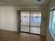 Living room with sliding glass doors that lead to sunroom at 529 Cervina S Dr, Venice, FL 34285