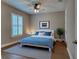 Comfortable bedroom with stylish decor, shuttered window, and ensuite bath access at 5832 Semolino St, Nokomis, FL 34275