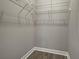 Walk-in closet with wire shelving offers functional storage for clothing and personal items at 5832 Semolino St, Nokomis, FL 34275