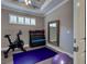 Home gym featuring workout equipment and a full-length mirror at 5832 Semolino St, Nokomis, FL 34275