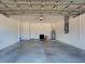 Spacious garage with concrete floor, storage and utility features at 5832 Semolino St, Nokomis, FL 34275