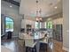 Bright, modern kitchen featuring granite countertops, stainless steel appliances and a large central island at 5832 Semolino St, Nokomis, FL 34275