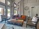 Comfortable living room with stylish furniture, a decorative rug, and large windows for plenty of light at 5832 Semolino St, Nokomis, FL 34275