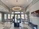 Beautiful lobby with a chandelier, stylish decor, and comfortable seating at 5832 Semolino St, Nokomis, FL 34275