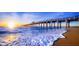 Picturesque pier stretching into the ocean at sunset, offering stunning water views at 5832 Semolino St, Nokomis, FL 34275