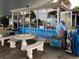 Exterior view of Pilot House featuring patio seating, beach supplies and seaside view at 5832 Semolino St, Nokomis, FL 34275